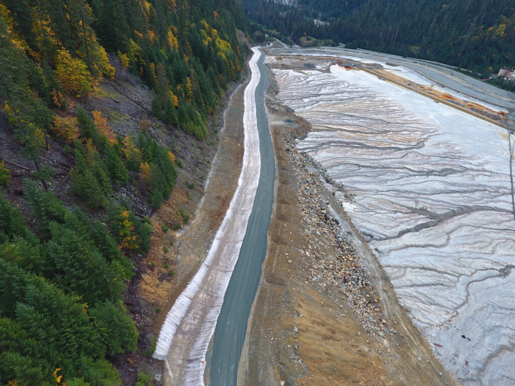 An aerial view of a mine diversion channel lined with concrete canvas.
